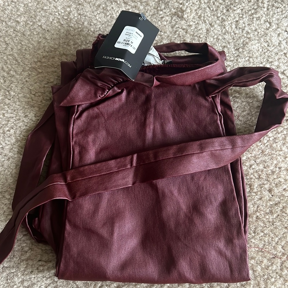 Never worn. Always gets better pants in burgundy with tag